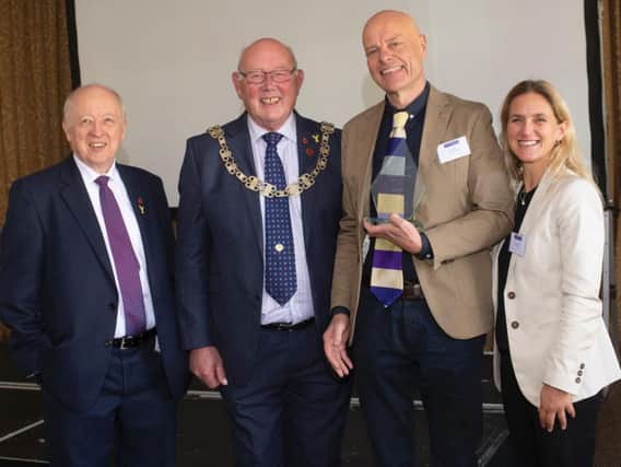 Tim Kirkup (third from left) with (from left) Councillor Carl Les, Leader of the County Council; Councillor Robert Windass, Chair of the County Council; and Kim Leadbeater, who presented the awards.