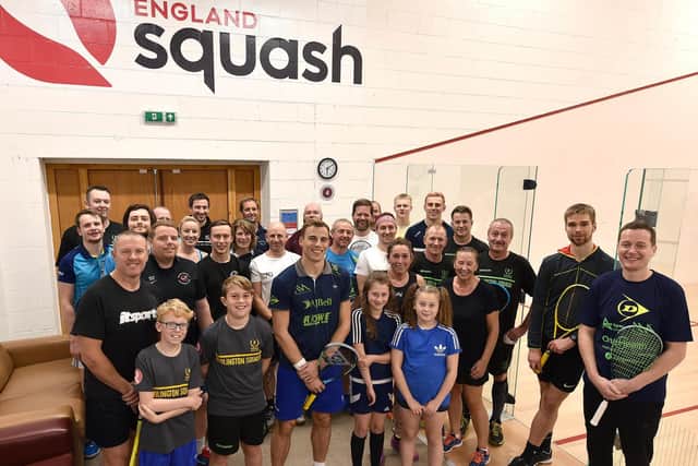 Three-time world champion Nick Matthew OBE, front row centre, with some of the guests at the newly-opened Scarborough Squash Academy at Scarborough RUFCs Silver Royd HQ. PICTURES BY RICHARD PONTER