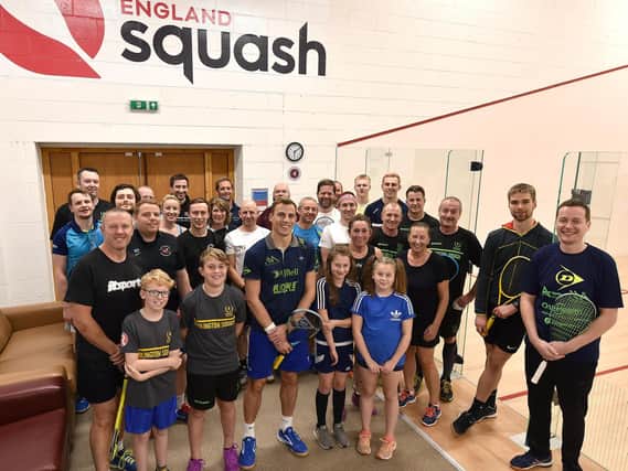 Three-time world champion Nick Matthew OBE, front row centre, with some of the guests at the newly-opened Scarborough Squash Academy at Scarborough RUFCs Silver Royd HQ. PICTURES BY RICHARD PONTER