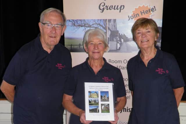 Peter Braithwaite, Andrea Cattle and Carol Fitz-Gibbon are pictured with the latest War Memorial book.