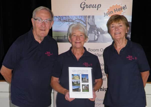 Peter Braithwaite, Andrea Cattle and Carol Fitz-Gibbon are pictured with the latest War Memorial book.