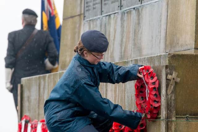 Poppy wreaths are laid at Oliver's Mount.