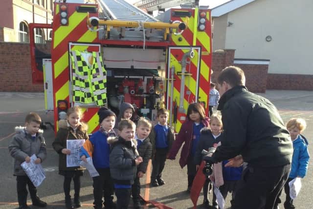 Firefighters make a special visit to Gladstone Road Primary School.