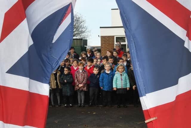 Pupils wait for the start of the service