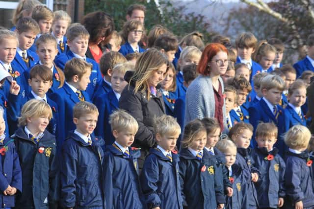 Terrington Hall pupils and staff observe the two minutes silence during the remembrance ceremony.