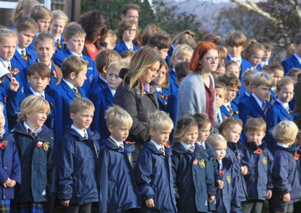 Terrington Hall pupils and staff observe the two minutes silence during the remembrance ceremony.