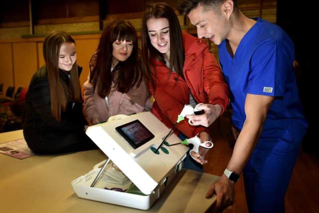Students have a go using real medical equipment brought in by Medical Mavericks