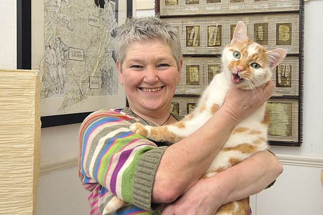 Local Scarborough artist Helen Birmingham with her cat Dr Johnson