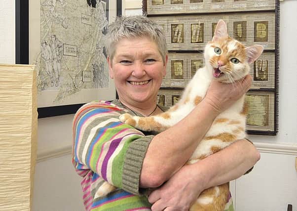 Local Scarborough artist Helen Birmingham with her cat Dr Johnson