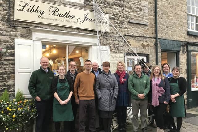 Members of the Helmsley in Business Group are pictured outside Libby Butler Jewellers, which paid for the tree.