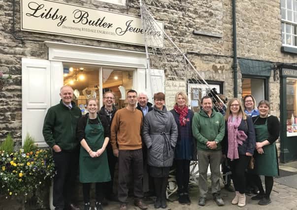 Members of the Helmsley in Business Group are pictured outside Libby Butler Jewellers, which paid for the tree.