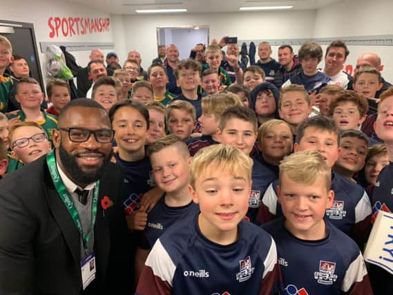 Scarborough RUFCs Under-12s in the changing rooms with ex-England international Ugo Monye