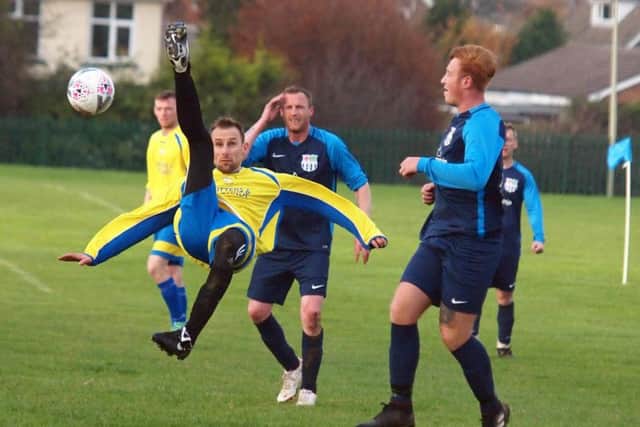 An Eastfield Town man tries an overhead-kick. Picture by Steve Lilly.