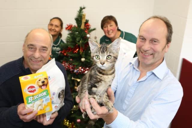 Mount Veterinary Group representatives with Ryedale Foodbanks John Mackenzie (left).