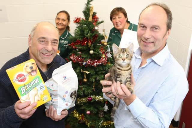 Veterinary nurse Stella Ellis (back left) with Ryedale Foodbanks John Mackenzie, James Wattrus from Cats Protection and veterinary nurse Michelle Coatsworth (back right)