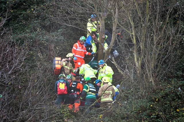 Emergency services treat the injured man. Photo by Richard Ponter.