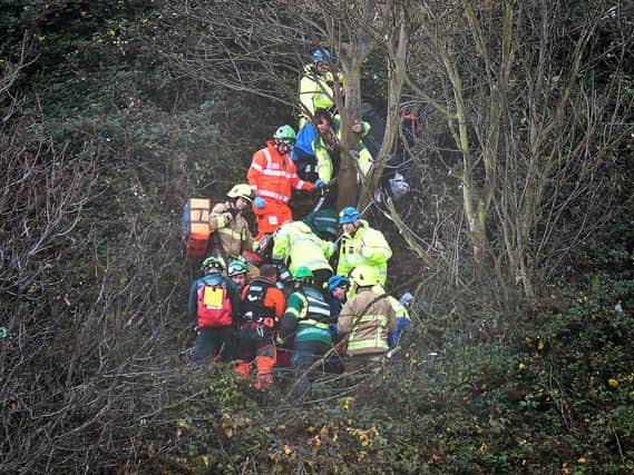 Emergency services treat the injured man. Photo by Richard Ponter.