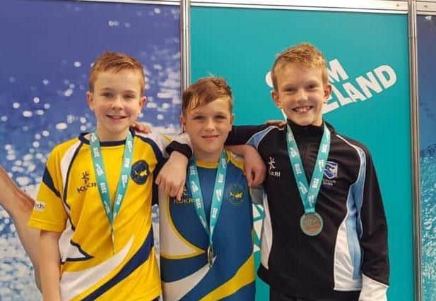 Jacob Bland (centre) qualified for the English Schools Diving Championships after sealing success at the Irish National Diving Championships