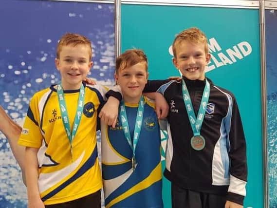 Jacob Bland (centre) qualified for the English Schools Diving Championships after sealing success at the Irish National Diving Championships