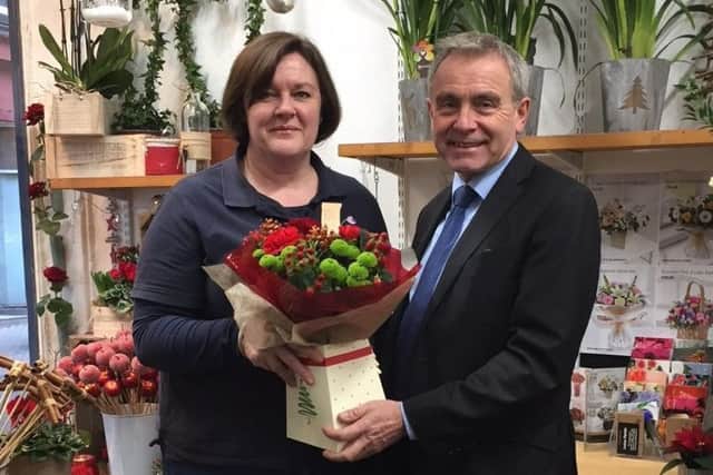 Robert Goodwill MP is pictured with florist Kate Wark.