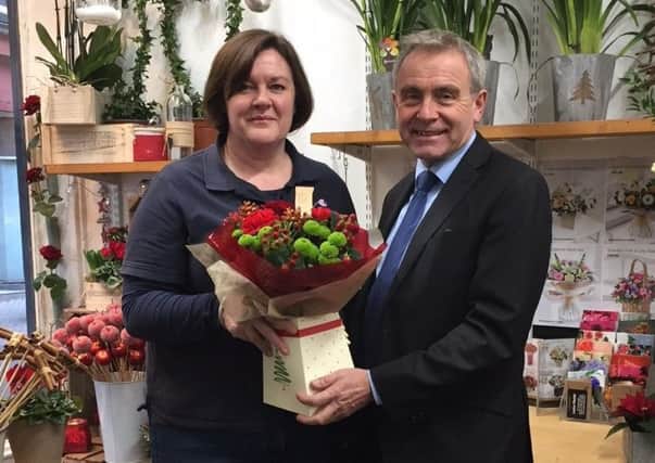 Robert Goodwill MP is pictured with florist Kate Wark.
