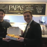 ead fryer Adrian Ganea and restaurant manager Jack Nee at Papas Fish and Chips on Foreshore Road.