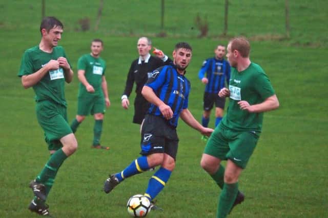 Jack Hakings battles for the ball in Newlands' win over Slingsby. Pictures by Steve Lilly.