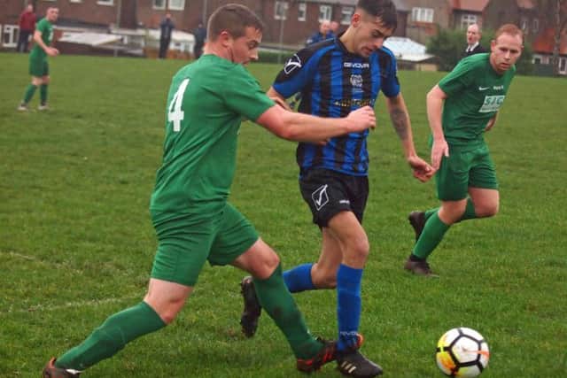 Newlands and Slingsby battle for the ball. Pictures by Steve Lilly.
