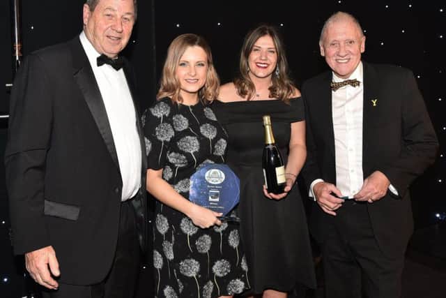 David Dowson and Harry Gration hand over the Tourism Award to the Spirit of Yorkshire DIstillery team.