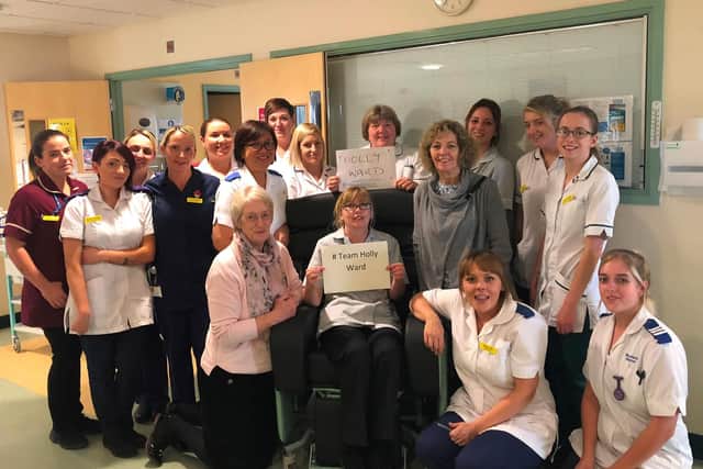 Staff on Holly Ward with therapy assistant Gail Dawes in the new chair.