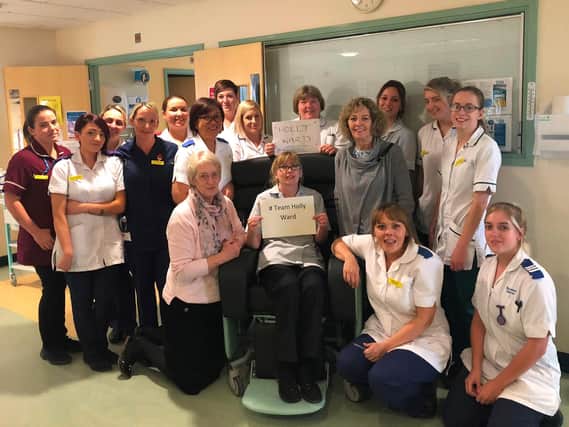 Staff on Holly Ward with therapy assistant Gail Dawes in the new chair.