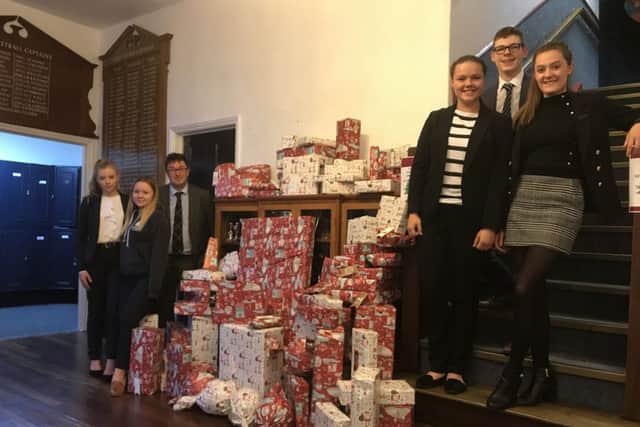 Scarborough College students and gifts for the Rainbow Centre.