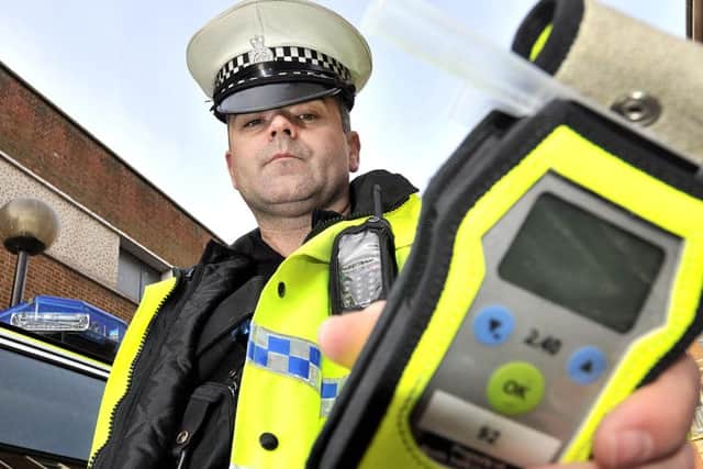 Scarborough Police promote a previous drink and drugs driving campaign in Scarborough . TC Paul Long with a breathalyzer.