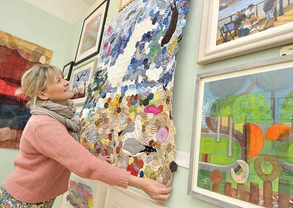 The East Coast Open art exhibition at Scarborough Art Gallery in 2017. Julie Baxter views textile display  Beach Life by Judith Clarke.
