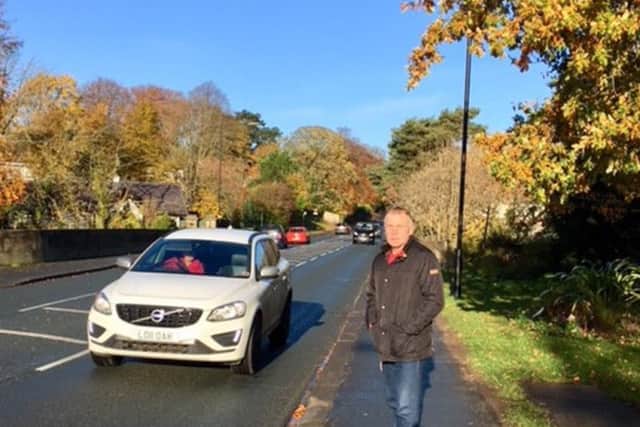 County Councillor Derek Bastiman at the site of the proposed traffic island