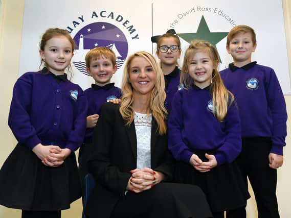 Quay Academy headteacher Kimberley Lawton celebrates with some of her pupils.