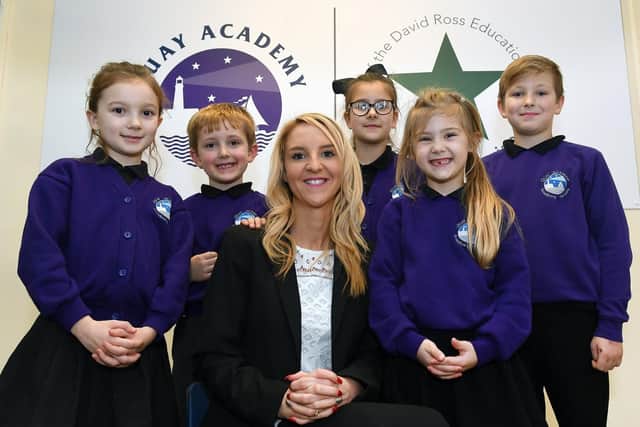 Quay Academy headteacher Kimberley Lawton celebrates with some of her pupils.