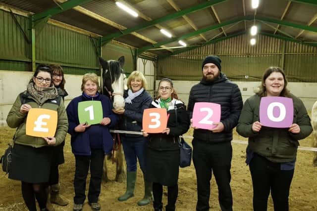 Yorkshire Building Society colleagues present the donation to Priory View Riding for the Disabled Association.