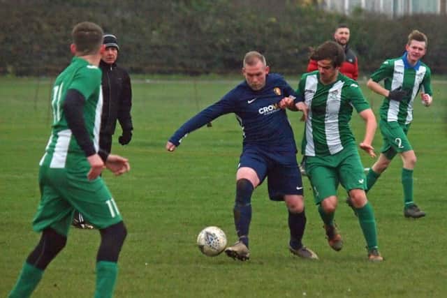 Gary Hepples of Edgehill and Fishburn's Paul Tose battle for the ball