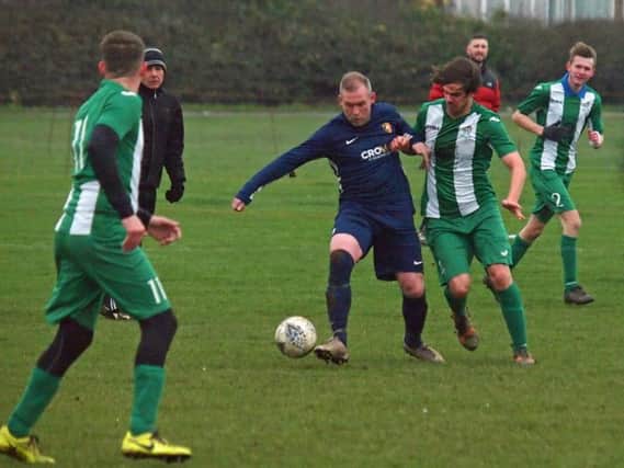 Gary Hepples of Edgehill and Fishburn's Paul Tose battle for the ball
