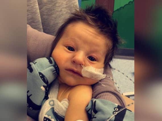 Three week old Jaxon is recovering from his first open heart surgery