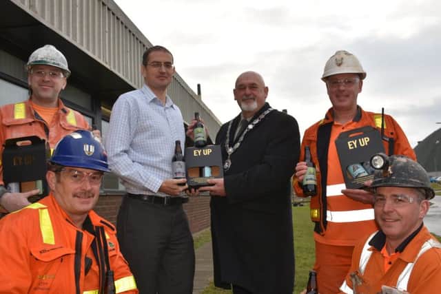 ICL Boulby workers getting present of their own brand beer.