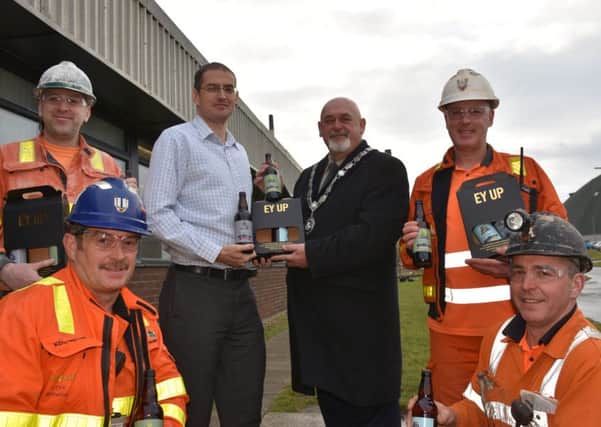 ICL Boulby workers getting present of their own brand beer.