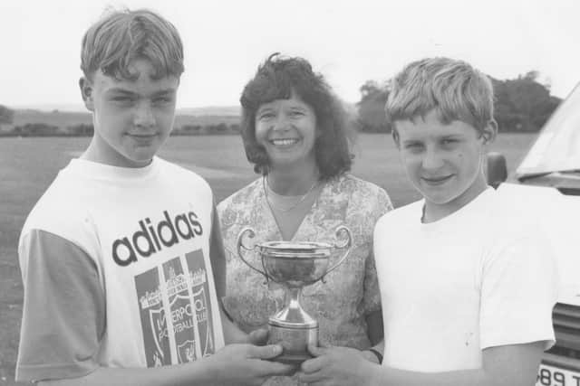 The Junior Inter Schools Town Sports were held at Filey School in June 1995, with Filey School headmistress Kerin Rees presenting Craig Farrell, left, and Daniel Thundercliffe, of Graham School, with the winners' trophy.