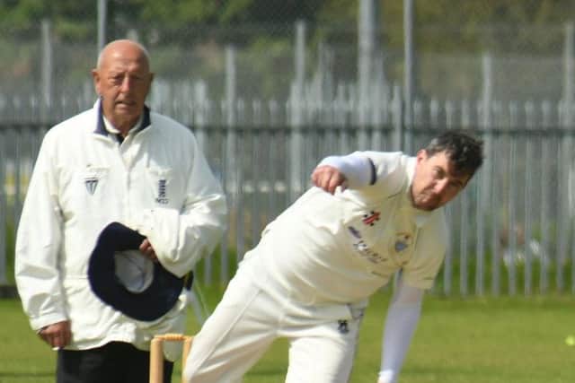 Umpire Mick Stubbs looks on as Brid's Pete Bowtell bowls