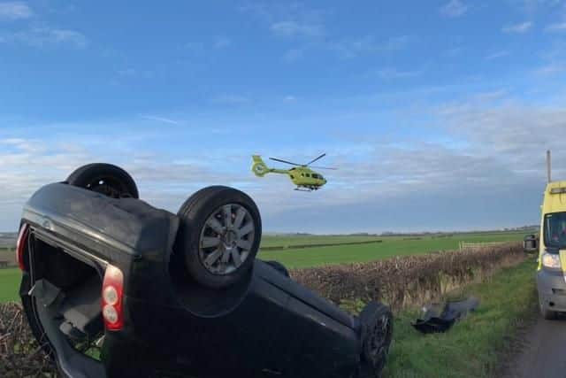 A car has overturned near the Royal Oak level crossing.