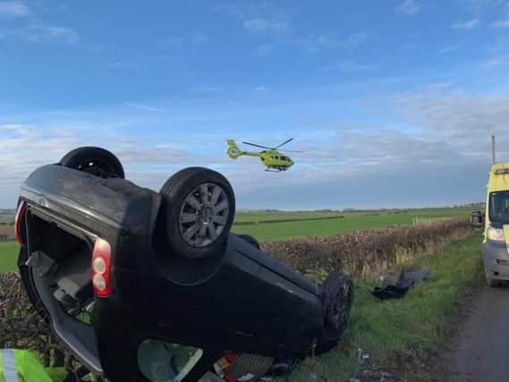 A car has overturned near the Royal Oak level crossing.