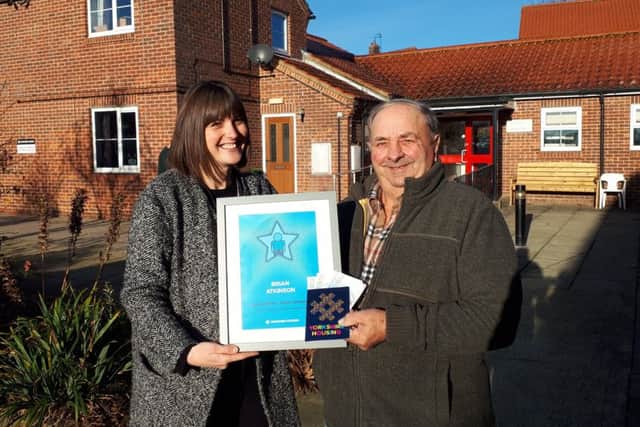 Lucy Jennings presents Brian Atkinson with his certificate.