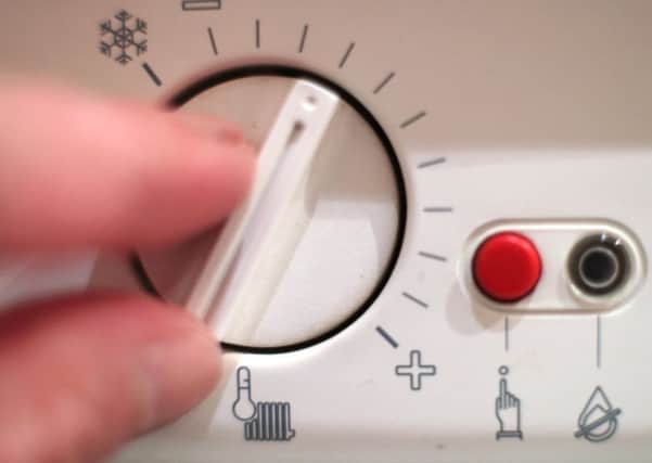 A thermostat dial controlling the temperature of a boiler.