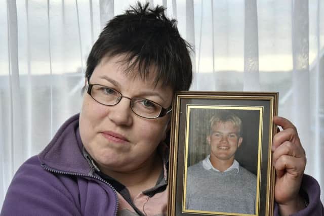 Peter Taylors sister, Nicola, with a photo of her late brother, Peter, who died aged 42 on January 2